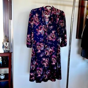 Lightweight floral a knee length dress with front tie.